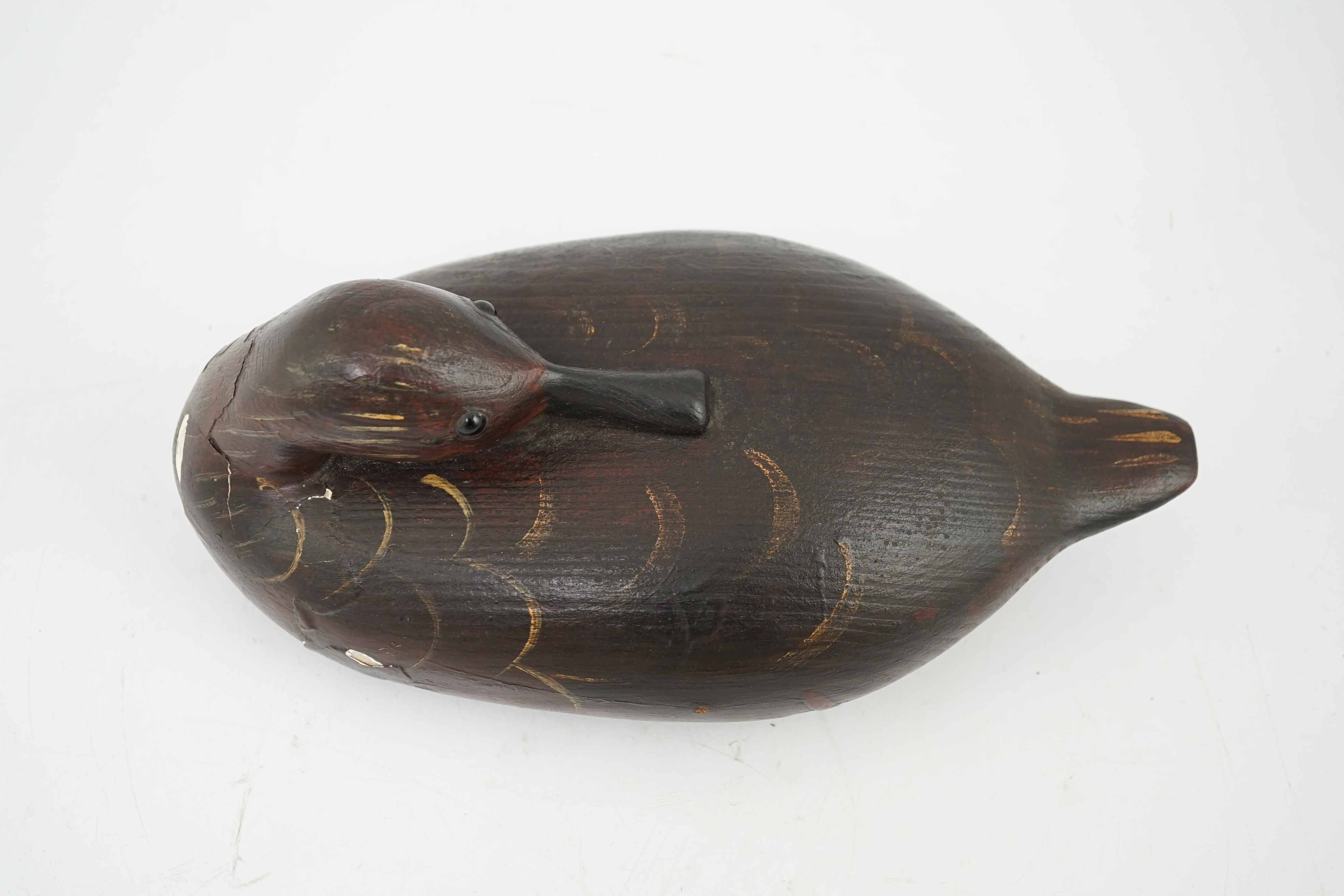 Guy Taplin (British, b.1939), a carved and painted oak model of a duck